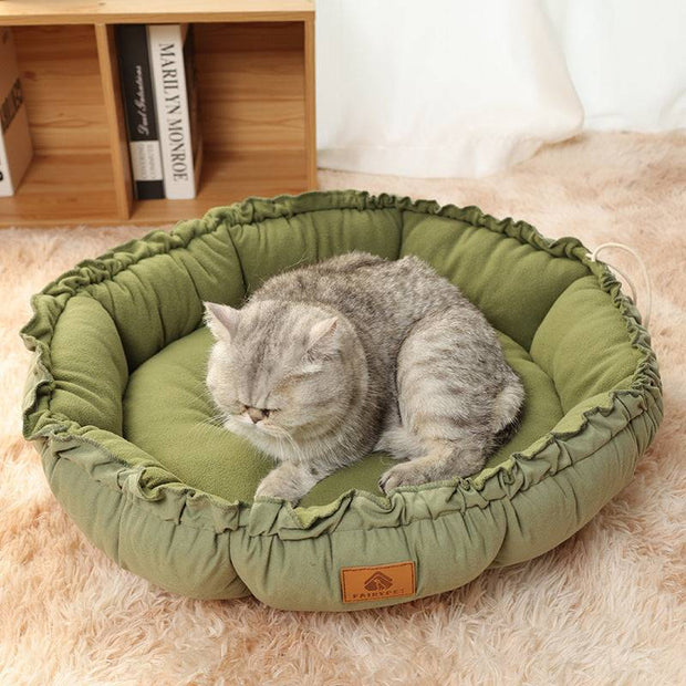 Grey calming pet bed with a supportive bolstered rim.
