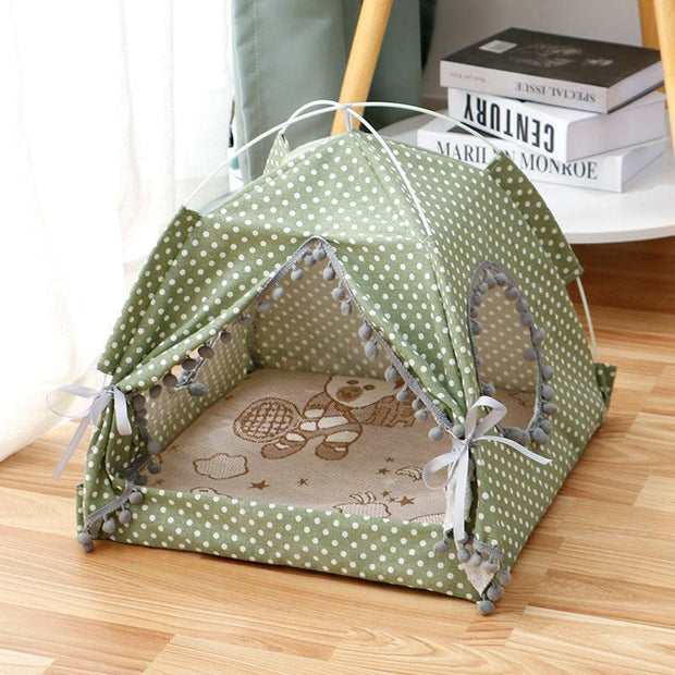 Green polka dot Enclosed Cat Tent Bed with mesh windows and soft cushion, ideal for indoor pet comfort and privacy.