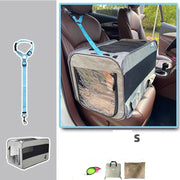 Small folding pet travel carrier bag secured on a car seat with safety strap, breathable mesh sides for pet comfort.