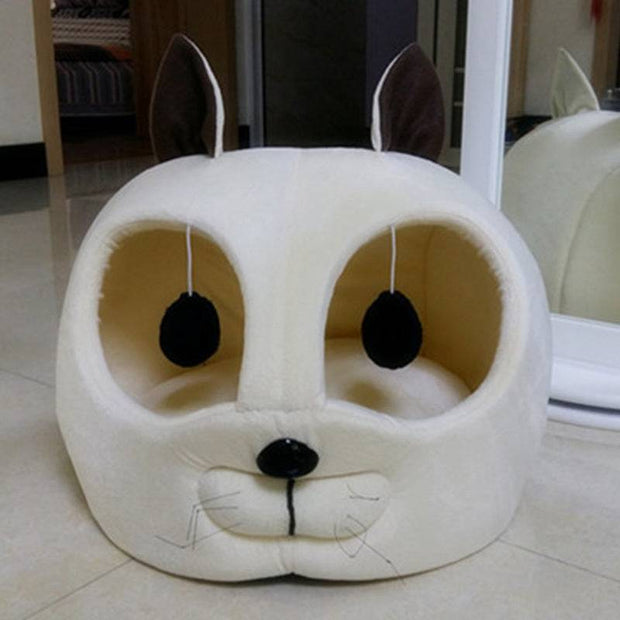 Cozy pet bed shaped like an animal head for dogs and cats.
