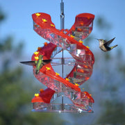 Spiral hummingbird feeder with orange climbing ladder design.
