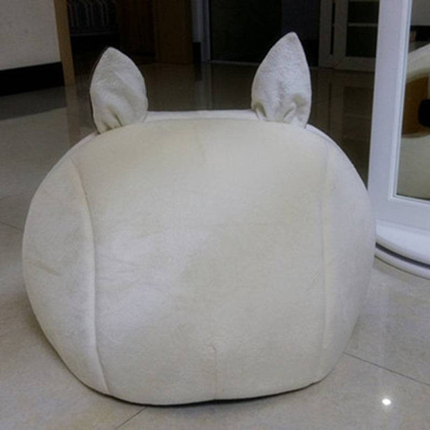 Soft cat bed resembling a cute animal character.
