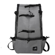 Gray Double Shoulder Dog Carrier Backpack with black mesh sides and adjustable buckles. Ideal for carrying pets during travel or hiking.