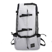 Light gray Double Shoulder Dog Carrier Backpack with black mesh sides and secure buckles. Ideal for small to medium pets during travel.