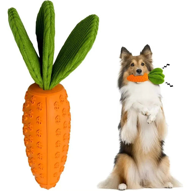 Carrot-shaped dog chew toy with plush leaves held by a standing dog, ideal for dental care and boredom relief.