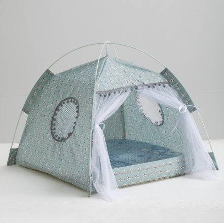 Blue floral Enclosed Cat Tent Bed with white mesh drapes and soft base, designed for indoor pet comfort and privacy.