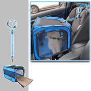 Blue folding pet carrier secured in front car seat with safety strap, mesh top and side for ventilation and visibility.